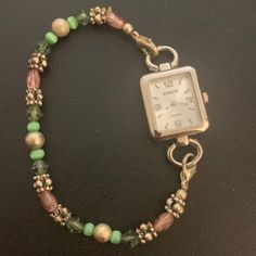 Pretty Bracelet Watch. Pink, Green, Silver Beads . Has Stretch.See All Photos. Square Face. Quartz Movement. Brand New Battery In July ! Connects On Both Sides For Easy On And Off. I’m A 7 In Wrist, This Is Big On Me. It’s For A 7.5-8 Wrist. Big Beaded Jewelry, Big Beaded Bracelets, Beaded Watches Bracelet, Beaded Watches, Handmade Watch, Watch Jewelry, Square Face, Old Watches, Watch Bracelet