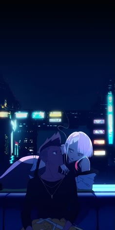 two people sitting at a table in front of a cityscape with neon lights