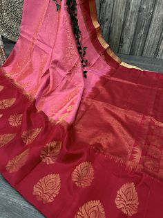 Gorgeous pink brocade pure silk handloom saree with a contrast red border. -Blouse fabric included. -Fall attached. Note:  - Slight inconsistency in weaving is inherent to handloom sarees and is not a defect. -The color of the products may slightly vary according to the ambient lighting conditions and the color calibration of LED devices. If you would like more clarity before your purchase, please drop us a message . Pink Katan Silk Saree With Border, Pink Tussar Silk Traditional Wear With Border, Pink Art Silk Traditional Wear With Border, Pink Katan Silk Dupatta With Border, Pink Katan Silk Traditional Wear With Border, Pink Handloom Saree For Celebration, Pink Traditional Wear With Border For Puja, Celebration Pink Tussar Silk Saree, Pink Traditional Wear For Diwali With Border