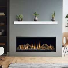 a living room with a fire place and potted plants