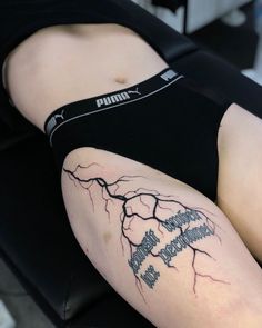 a person with a tattoo on their leg