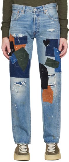 Straight-leg non-stretch denim jeans. Graphic patches, fading, whiskering, and distressing throughout. · Belt loops · Five-pocket styling · Button-fly · Cropped cuffs · Logo patch at back waistband · Logo flag at back · Contrast stitching in orange and yellow Supplier color: Indigo Patchwork Jeans Men, Pant Patches, Repair Jeans, Denim Repair, Patchwork Denim Jacket, Levis Outfit, Patchwork Denim, Patchwork Jeans, Patched Jeans