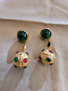 The earrings have a round 5 carat emerald cabochan post with a ball drop that has 2mm round emerald and ruby accents.  Solid 18K gold filled. Victorian Green Drop Earrings, Victorian Ruby Earrings, Victorian Ruby Jewelry In Round Shape, Victorian Gold Cabochon Earrings, Victorian 14k Gold Drop Earrings, Ball Drop, Bee Pendant, Sapphire Necklace, Ruby