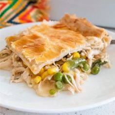 a piece of chicken pot pie on a white plate