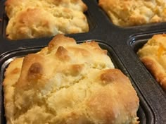 three muffins sitting in a baking pan on top of a counter next to each other