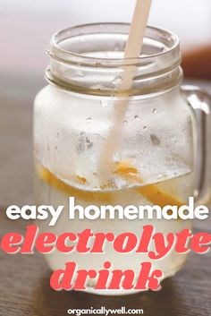 an easy homemade electrolyte drink in a mason jar with a straw sticking out