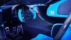 the interior of a sports car with blue trim