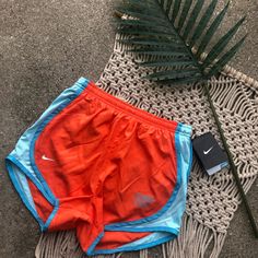 New With Tag Nike Running Shorts Size Xs Style- Tempo Short Collegiate Illinois State Orange Printed Shorts With Light Blue Sides Orange Workout Shorts For Summer, Orange Gym Shorts For Summer, Orange Athleisure Athletic Shorts For Summer, Orange Athleisure Shorts For Beach, Orange Athleisure Shorts For The Beach, Orange Athleisure Beach Shorts, Nike Orange Short Bottoms, Orange Athletic Sportswear Shorts, Orange Athletic Shorts For Summer Sports