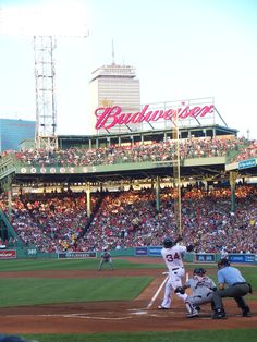 a baseball game in progress with the batter up to plate