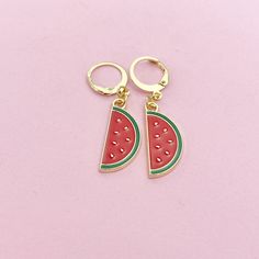 This is gold tone watermelon charm on stainless steel ear hook. ♥ You will get one pair. HOW TO ORDER 1) Choose the quantity 2) Choose the style (dangle/drop or lever back/hoop) 3) Add to the cart DESCRIPTION ♥ Gold over Stainless Steel Earring Findings, Size: about 0.67 inch(17mm) long, 0.71 inch(18mm) wide, 0.09 inch(2.4mm) thick, or 14.5x12mm hoop ♥ Watermelon Charm, Alloy Enamel Pendants, Red, Size: about 0.39 inch(10mm) wide, 0.89 inch(22.5mm) long, 0.04 inch(1mm) thick ♥ Materials sourced Cute Gold Summer Jewelry, Gold Dangle Fun Jewelry, Fun Gold Dangle Jewelry, Fun Nickel Free Drop Earrings, Watermelon Color Dangle Jewelry For Summer, Gold Fun Drop Earrings, Fun Gold Drop Earrings, Fun Nickel-free Metal Jewelry, Fun Gold Summer Jewelry