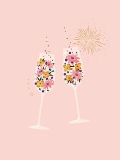 two champagne glasses with flowers and fireworks on pink background