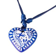 Beautiful in blue this delightful necklace is centered by a heart. Edith Orozco recreates motifs from Mexico's classic Talavera ceramics. A graceful swallow soars amid swirling brushstrokes known as plumeado or feathered on a beautiful necklace. The papier mache pendant is protected by a coat of lacquer and centers dark blue cords that are adjustable in length. Blue Necklace For Valentine's Day Gift, Blue Heart Beads Pendant Necklace, Bohemian Heart Necklaces For Valentine's Day, Blue Heart Pendant Necklace For Gift, Bohemian Heart Charm Necklace, Bohemian Heart Necklace For Valentine's Day, Blue Double Heart Charm Necklace, Blue Heart Beads Necklace As Gift, Blue Double Heart Necklace With Heart Charm