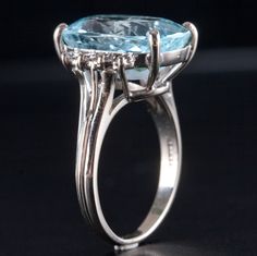 14k White Gold Oval Aquamarine Diamond Cocktail Ring 6.31ctw 5.42gMetal Information: 14k White GoldTotal Weight: 5.42gBand Width: 1.75mmSize: 6Additional Information: Aquamarine Shows WearStone InformationMain StoneGem Type: AquamarineShape: Oval (15.1mm x 10.9mm)Color: Light BlueClarity/Quality: ACarat Weight: 6.07ctNumber of Stones: 1Accent StonesGem Type: DiamondShape: Round (2.0mm)Color: HClarity/Quality: SI1Carat Weight: .03ctNumber of Stones: 8Total estimated ctw (carat total weight): 6.31ctwEstimated Retail Price: $2695.00OUR PRICE: $2155.00SizingMany of our pieces can be re-sized at the buyers request. Please email us if you require our skilled professional services.46011 Oval Topaz Ring In Platinum, Oval Topaz Ring For Formal Occasions, Formal Oval Topaz Ring With Prong Setting, Modern Oval Topaz Ring For Formal Occasions, Formal Oval Topaz Ring With Polished Finish, Brilliant Cut Oval Topaz Ring, Oval Topaz Ring With Polished Finish, Oval Vvs Clarity Topaz Ring, Oval Aquamarine Fine Jewelry