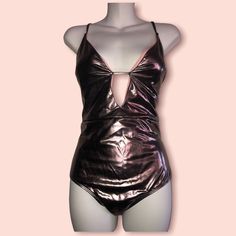 Ultra Sexy Xoxo Deep Plung Metallic One-Piece Swimsuit With Crisscross Straps Pewter Color With Pink Lining Never Worn Size Xl Removable Bra Inserts Adjustable Shoulder Straps Summer V-neck Bodysuit For Club, Fitted Crisscross Bodysuit For Summer, Pink One-piece Bodysuit For Night Out, Triangle Top Bodysuit For Club With Lined Body, Triangle Top Bodysuit With Lined Body For Club, Triangle Top Lined Bodysuit For Club, Fitted Triangle Top Bodysuit For Night Out, Glamorous Backless Bodysuit For Club, Party Swimwear With Crisscross Straps And Backless Design