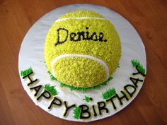 a tennis ball cake with the words deniz happy birthday on it's side