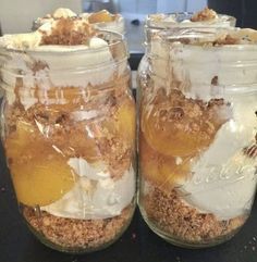 two jars filled with food sitting on top of a table