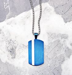 "《 《 FOR YOUR JOURNEY COLLECTION 》 》 THE DETAILS The \"MATTE BLUE TAG\" Necklace is designed with an exquisitely detailed smooth Brushed Blue Stainless Steel Dog Tag Pendant, with an intricately engraved diamond pattern Silver Stripe, hung from a Silver Stainless Steel Box Chain available in your choice of length! 🔷️🔶️💠🔶️🔷️View the entire FOR YOUR JOURNEY COLLECTION here: https://www.etsy.com/shop/mrmackjewelry/?section_id=27030044 MATERIALS * 1 1/2\" × 1\" Matte Blue & Silver Stainless Ste Blue Stainless Steel Necklace Ideal For Gift, Blue Stainless Steel Necklace For Gift, Blue Pendant Necklace With Box Chain, Blue Box Chain Necklace As A Gift, Blue Box Chain Necklace For Gift, Blue Stainless Steel Necklace, Blue Pendant Jewelry With Box Chain, Blue Box Chain Jewelry Gift, Modern Stainless Steel Dog Tag Necklace