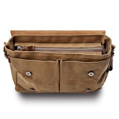 Stay organised on the go with this versatile men's messenger bag. Features a main compartment with four inner pockets, a padded laptop section, and two accessible front pockets under the flap. The side pockets accommodate a water bottle or umbrella, while the secure back pocket offers extra space. Constructed from durable canvas and enhanced with timeless leather accents. Men's Messenger Bag, Leather Accents, Messenger Bag Men, Staying Organized, Color Shades, The Go, Messenger Bag, Umbrella, Adjustable Straps