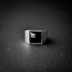 A handmade sterling silver 925 square shaped onyx stone signet ring.Each ring is cleaned and polished with care.The weight of the ring may vary according to size.Top measurements: Width - 13mm | Hight - 13mmApprox weight: 8.14grThe ring is set with one square shaped, rose cut black onyx stone.*The ring is hollowed out from the inside*This ring is made to order! Please allow up to 21 business days to be made before shipment. If you have any further questions, please don’t hesitate to contact us.B Modern Onyx Signet Ring For Gift, Minimalist Silver Onyx Signet Ring, Modern Onyx Signet Ring Gift, Modern Black Sterling Silver Signet Ring, Rectangular Onyx Signet Ring Gift, Black Sterling Silver Rectangular Signet Ring, Minimalist Silver Rings With Rectangular Stone, Minimalist Silver Square Ring, Minimalist Silver Square Cut Ring