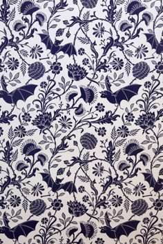 an intricately designed wallpaper with birds and flowers in blue on white background, from the late 19th century