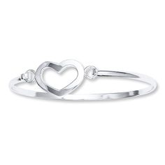 A romantic heart embellishes this sterling silver bangle bracelet for her. Heart Charm Bangle For Anniversary, Anniversary Heart Charm Bangle Jewelry, Anniversary Bangle With Heart Charm, Sterling Silver Bangle With Heart Charm, Elegant Heart Shaped Bracelets With Sterling Silver Clasp, Elegant Open Heart Jewelry With Sterling Silver Clasp, Silver Bangle Jewelry For Promise, Sterling Silver Clasp Bracelet For Valentine's Day Anniversary, Anniversary Bangle Bracelet With Heart Charm