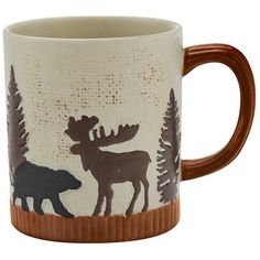 a coffee mug with moose and bear designs on it