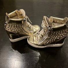 -Used But In Wearable Condition -Comfortable Wedge Height -Missing Spike (Pictured) -Multiple Scuff Marks As Pictured Missing Accessories: Shoebox + Dust Bag Gold Wedge Sneakers With Round Toe, Sneaker Heels Wedges, Studded Shoes, Comfortable Wedges, Zanotti Shoes, Stage Outfit, Giuseppe Zanotti Shoes, Unpopular Opinion, Heels & Wedges