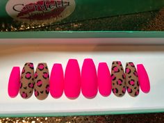 "Description: This set is created with gel polish. There are 2 accent nails (middle finger and ring finger) that are painted in leopard print. The other nails are painted in hot pink. All nails are finished in a matte top oat. The nails in the photo #1 are created in the long coffin shape. Standard nail sets come 14 to a set so accurate measuring of your nails is important to get the sizing correct. Measuring instructions are located in the photos. If your nails do not fit the standard sizes ava Hot Pink Christmas Nails, 2 Accent Nails, Pink Leopard Nails, Hot Pink Leopard Print, Rainbow Nails Design, Yellow Nail Art, Hot Pink Leopard, Square Nail Designs, Leopard Print Nails