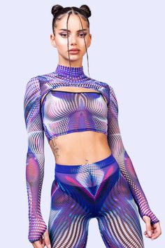 The Fata Morgana 2-Piece Shrug Top is a festie must have. Pair with the matching leggings for a finished trippy lewk.FEATURES:> Slinky Crop Top> Mock Neckline Shrug With Thumbhole Cuffs> Flattering Form-Fitting Construction> Luxurious & Silky, See-Through Mesh Fabric> Flawless Graphics On Both Front Trendy Fitted Top For Festival, Stretch Top For Spring Rave, Stretch Rave Tops For Spring, Multicolor Stretch Party Sets, Fitted Multicolor Tops For Festival, Trendy Stretch Club Sets, Purple Stretch Party Sets, Stretch Purple Tops For Club, Purple Stretch Tops For Club