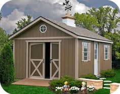 a small shed sitting in the middle of a yard