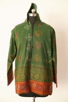 Welcome To Our Shop Product: One-Of-A-kind Handmade 100% Cotton Vintage Kantha Jacket. Color: Multi-color as Shown in Image. Fabric: 100% cotton ( Handmade In India ) The design of the jacket is very unique and very rare. Indian culture and associated with grace and beauty. Old hand made raali more then 1970s old pieces collected From villages Of Thar Desert converted into the vintage jacket and backside beautiful embroidery elephant work, This Raali belongs to higher caste people they give this Traditional Hooded Outerwear For Festival, Festive Green Outerwear With Stand Collar, Festive Long Sleeve Winter Outerwear, Traditional Green Outerwear With Stand Collar, Traditional Green Stand Collar Outerwear, Green Bohemian Outerwear For Festival, Vintage Green Outerwear With Stand Collar, Traditional Winter Festival Tops, Embroidered Green Outerwear For Winter