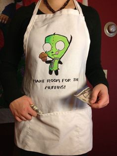 a woman wearing an apron holding money in her hands