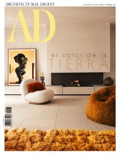 the front cover of architectural digest magazine with an image of a living room and fireplace