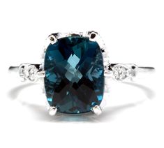 4.08 Carats Natural Impressive LONDON BLUE TOPAZ and Diamond 14K White Gold Ring Suggested Replacement Value $2,900.00 Total Natural London Blue Topaz Weight is: Approx. 4.00 Carats London Blue Topaz Measures: Approx. 10.00mm x 8.00mm Natural Round Diamonds Weight: Approx. 0.08 Carats (color G-H / Clarity SI1-SI2) Ring total weight: Approx. 4.0 grams Disclaimer: all weights, measurements and colors are approximate and may vary slightly from the listed dimensions or as seen in the image. All pict Halo Wedding Set, Emerald Cut Rings, Vintage Sterling Silver Rings, Etsy Gold Ring, 14k White Gold Ring, Diamond Cluster Ring, White Gold Ring, London Blue Topaz, London Blue