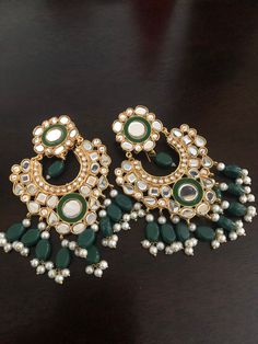 Beautiful high quality sheesha kundan earrings with green and black meena work! Pre-order and making time 3-4 weeks. Heavy Green Chandbalis For Party, Green Heavy Chandbalis For Party, Heavy Green Earrings For Festive Occasions, Traditional Green Chandbalis For Party, Green Cutdana Chandbalis For Party, Traditional Green Bridal Earrings For Party, Festive Green Chandbalis For Party, Green Tikka For Party And Diwali Festival, Green Kundan Chandbalis With Gota Work