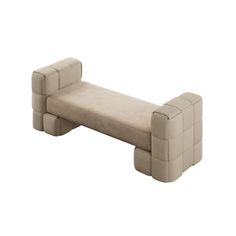 a white couch sitting on top of a wooden bench