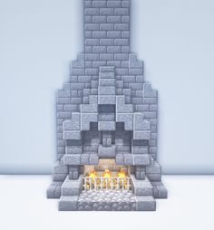 an image of a fire place made out of bricks and stone blocks with candles burning in it