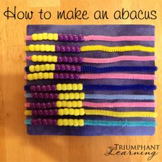 a bunch of colorful beads sitting on top of a wooden table