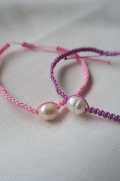 Handmade Pearl Bracelet | Friendship Bracelet, Adjustable Knotted Bracelet, Matching Bracelet, Couple Bracelet, Gift for Friendship These handmade bracelets are the perfect gift for friends, family, partners or even if its to treat yourself! Each bracelet is made with care and are easily adjustable. I hope you love them as much as I enjoy making them! The price displayed is for a singular bracelet or there is an option for the two at a discounted price. 𝐌𝐚𝐭𝐞𝐫𝐢𝐚𝐥𝐬: - 0.8mm Nylon Cord - F Adjustable Pearl Bracelet Gift, Handmade Friendship Bracelets For Mother's Day, Handmade Pearl Bracelet For Friendship, Handmade Adjustable Pearl Bracelet For Friendship, Handmade Adjustable Beaded Bracelets For Bridesmaids, Handmade Adjustable Pearl Bracelet Gift, Purple Resizable Bracelets For Friendship, Handmade Adjustable Beaded Bracelets As Bridesmaid Gifts, Handmade Adjustable Bracelet For Best Friend Gift