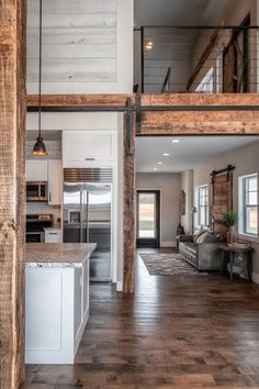 Modern barndominium interior with rustic-contemporary fusion, wooden beams, and open-concept kitchen with stainless steel appliances Kitchen Ideas Open Concept, Modern Barndominium Interior, Barndominium Kitchen Ideas, Barndo Interior, Barndominium Kitchen, Barndominium Interior