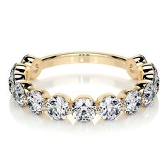 a yellow gold ring with five round diamonds on the side and two rows of smaller stones