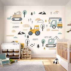 a child's room decorated in white and blue with trucks and trees on the wall