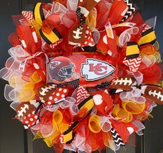 a football wreath is hanging on the front door