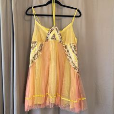 This Paneled Dress (Or Top) Is Something Out Of A Fairytale. It Has A Yellow Slip Underneath With A Pink Lemonade Mesh On Top. Patterned Details (See Photo) With Beading And Floral Fabric On Front. Ties Around The Neck. Very Short! Could Be Worn As Nightgown, Or Even A Top. Yellow Lace Mini Dress For Summer, Fitted Nightgown For Summer Parties, Fitted Summer Nightgown For Party, Yellow Summer Sleep Dress, Spring Party Lace Nightgown, Yellow Summer Nightgown For Sleep, Yellow Sleeveless Summer Sleepwear, Bohemian Yellow Mini Dress For Party, Yellow Summer Nightgown