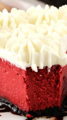 a piece of red velvet cake with white frosting