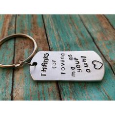 a metal keychain with the words, i can't stop loving you