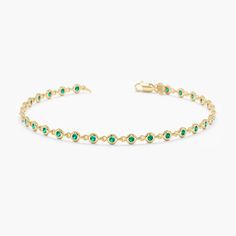 Handmade Natural Emerald Tennis Bracelet In Solid 14k Gold Elegant Green Gemstones For Formal Occasions, Timeless Green Jewelry With Bezel Setting, Luxury Green Oval Bracelet, Timeless Green Birthstone Jewelry, Yellow Gold Bracelet With May Birthstone Gemstone, Luxury Green Diamond Bracelet Hand Set, Luxury Green Hand Set Diamond Bracelet, Green Luxury Bangle Jewelry, Formal Emerald Gemstone Bracelets