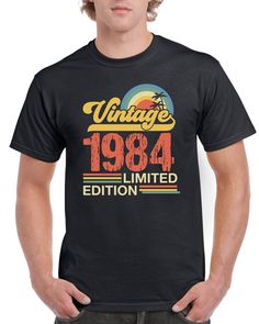 "🎁 Perfect gift for a 40th Birthday 🎂: Celebrate a major milestone with this unique Vintage Year 1984 Limited Edition T-shirt.  ✔️ Quality Material 🧵: Made from soft cotton blend, designed for comfort, durability and breathability.  👕 Graphic T-Shirts : This Birthday T-shirt boasts a bold, high-quality print, professionally done with cutting-edge print technology. 👨 Great Fit for Men : Designed with an understanding of the male physique, ensuring a flattering and comfortable fit for men of all sizes. 🎈 40 is the new 30 : Ideal gift for the man who's celebrating his 40th birthday but maintains the spirit and energy of a 30 year old! 🔥 Unique Craftsmanship : Each t-shirt is individually crafted guaranteeing exceptional attention to detail. No two shirts are the same - just like those Old Funny, Fit For Men, Classy Men, Mens Cotton T Shirts, Funny Vintage, Birthday Gift For Him, 30 Years Old, Male Physique, Tee Shirt Homme