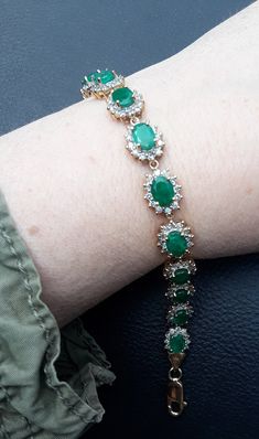 Absolutely Stunning 14k Gold, Diamond Emerald Flower design Bracelet .. Natural  Columbian Emerald in beautiful  bright green  color. WOW  Look Spectacular,  perfect Vintage Pre Owned Condition.  All sales are final,  no return.  Some Pics ENLARGED to see details. ATTENTION BUYERS ALL ITEMS FROM MY SHOP MUST BE PURCHASED STRAIGHT THRU ETSY.COM WEBSITE ONLY,  NOT THRU OFFSITE ADDS GOOGLE AND OTHERS  All orders purchasing from Google and others will be cancelled  NOT SELLING TO BUYERS THRU  ETSY APP  Etsy charging me $100 extra fee from each order, if item sold FROM OFF-SITE ADS, Including Etsy App ONLY ETSY.COM WEBSITE Luxury Green Oval Bracelet, Green Jubilee Bracelet For Wedding, Luxury Green Emerald Bracelets, Green Formal Bracelets In Fine Jewelry Style, Green Gemstone Bracelets, Elegant Green Bracelets For Wedding, Green Fine Jewelry Bracelets For Formal Occasions, Green Formal Bracelet Jewelry, Green Formal Fine Jewelry Bracelets