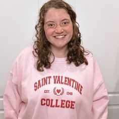 This Saint Valentine's College sweatshirt is the perfect twist on your typical collegiate sweatshirt. The graphic features an athletic font with a heart crest in the center. This sweatshirt is perfect for lounging around the house, running errands, or gifting to your favorite Galentine. Unisex Sizing; Size up for an oversized fit Pill-resistant fleece Machine washable 50/50 cotton/poly blend Screen Printed in Red Ink Sweatshirt color is Light Pink Collegiate Sweatshirt, Athletic Fonts, College T Shirts, College Sweatshirt, Saint Valentine, Red Ink, 50 50, Unisex Shirt, A Heart